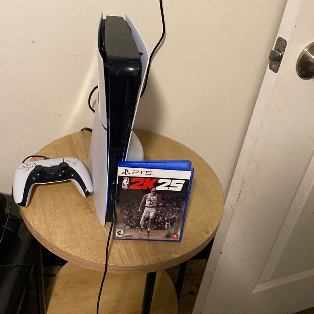 I am selling a ps5 with a controller and 2K25 included and spider man and a tv